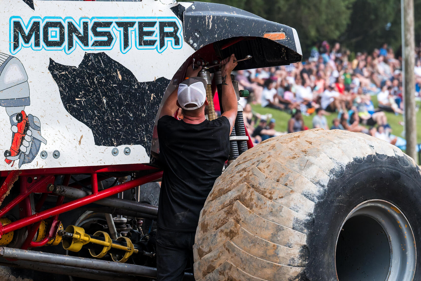 WESTMINSTER, MD - A mechanic makes adjustments to the Metal Monster truck during the Monster Truck Roundup on July 11, 2026, at the Carroll County AG Center.
