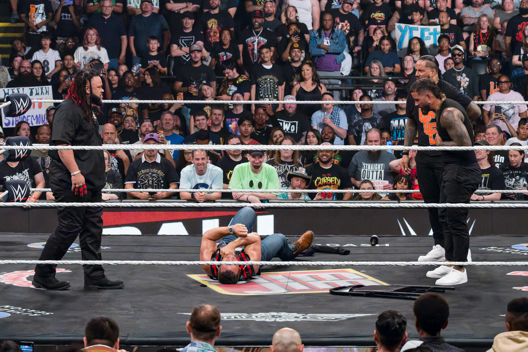 BALTIMORE, MD - Jacob Fatu stands with The Usos over LA Knight in the aftermath of an attack during a WWE Monday Night Raw segment on June 15, 2026, at CFG Bank Arena.