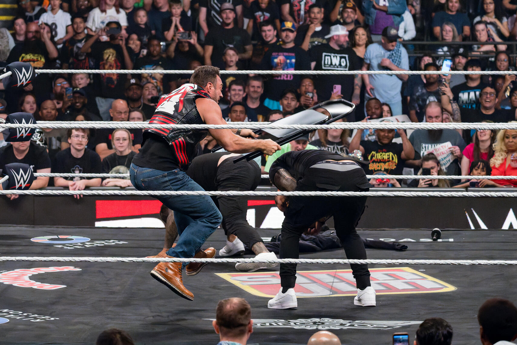 BALTIMORE, MD - WWE Superstar LA Knight swings a steel chair during WWE Monday Night Raw on June 15, 2026, at CFG Bank Arena.